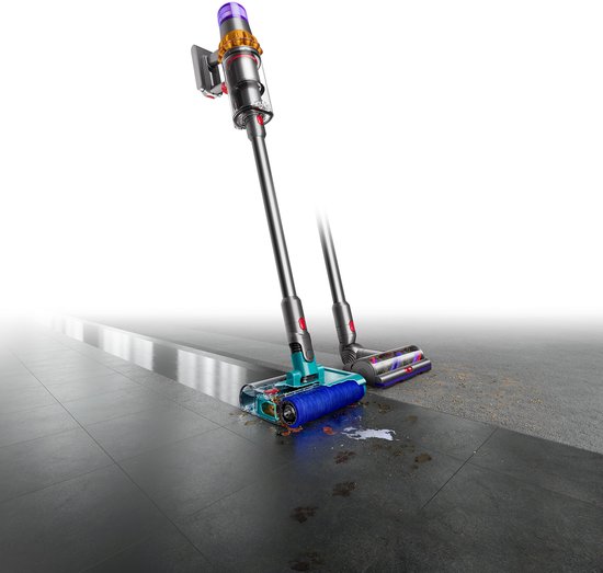 Draadloze steelstofzuiger met paarse, gele en zilveren details en turquoise en rode opzetstukken op een donkergrijze tegelvloer.