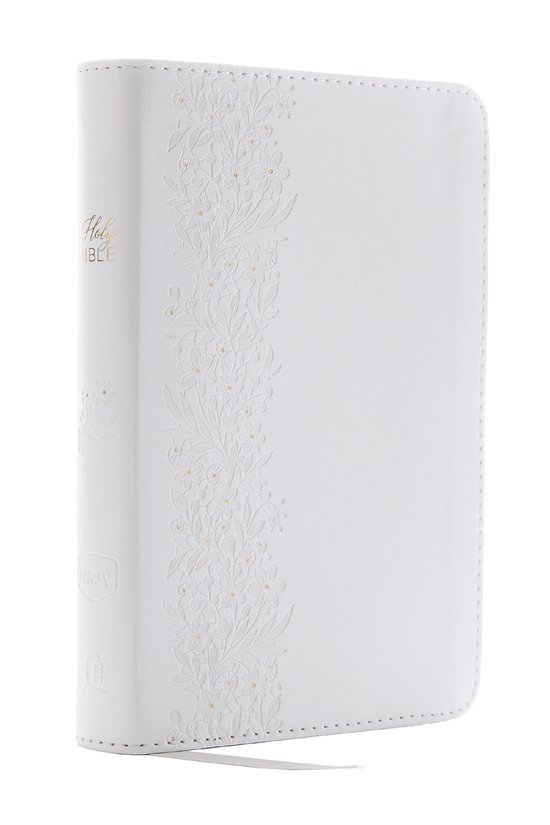 Bible blanche avec 'Holy Bible' doré sur le dos et un motif floral sur la couverture avant.