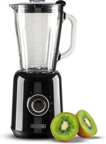 Zwarte retro blender met glazen kan, ernaast twee halve kiwi's.
