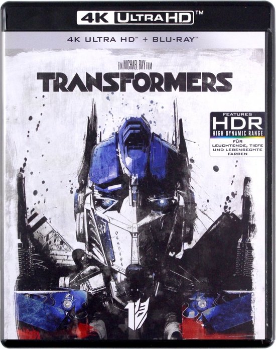 Blu-ray hoes van 'Transformers' met een afbeelding van Optimus Prime in een blauw-witte kleurstelling met verfspatten.
