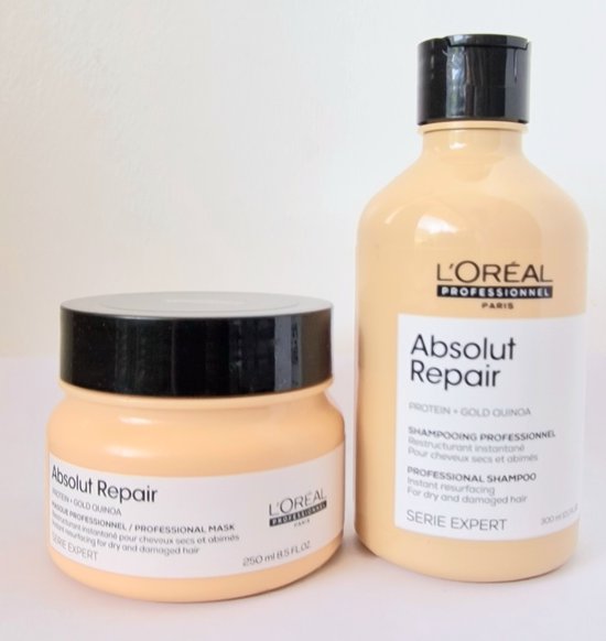 Shampoing et Masque L'Oréal Absolut Repair, flacon et pot beiges avec bouchons noirs.