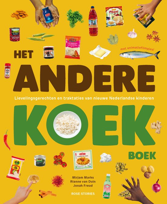 Boekcover 'Het Andere Koek Boek' met diverse ingrediënten zoals rijst, vis, pepers en kruiden.
