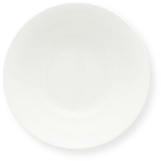 Zijenaanzicht van een enkele witte porseleinen kom.