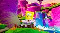 SpongeBob met belletjes bij een waterval in een kleurrijke, paarse en groene omgeving.