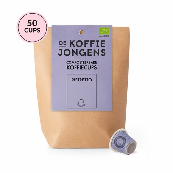 Bruine papieren zak met daarop een paars label voor 'De Koffiejongens Composteerbare Koffiecups Ristretto'. Een roze cirkel met '50 CUPS'. Eén koffiecup ligt ernaast.