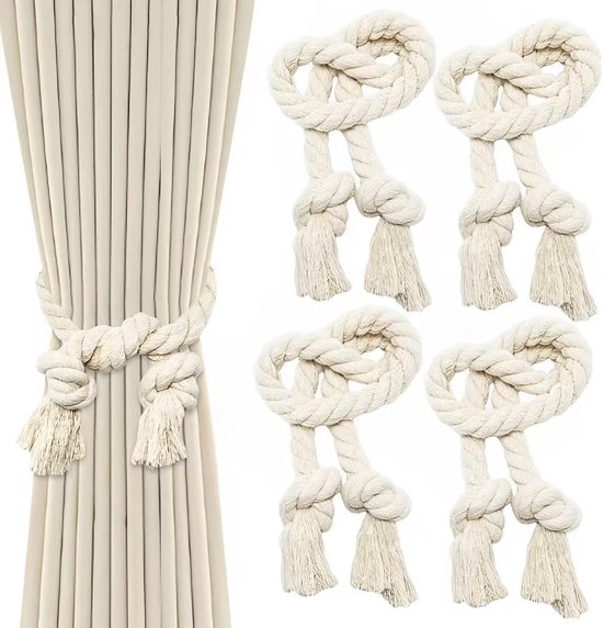 Quatre embrasses de rideaux beige en cordelette de coton tressée avec pompons, dont une attachée à un rideau beige.