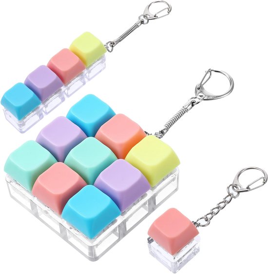 Différents petits jouets anti-stress pour clavier pastel avec porte-clés.