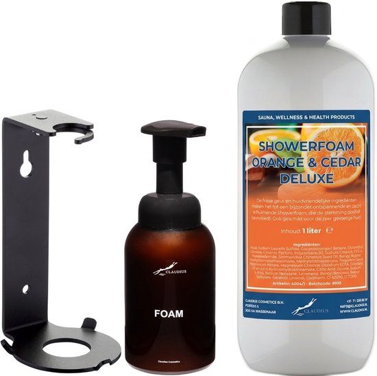 Set met een zwarte zeepdispenserhouder, een bruine schuimzeepdispenser met het opschrift "FOAM" en een fles showerfoam met "ORANGE & CEDAR DELUXE" op het etiket.