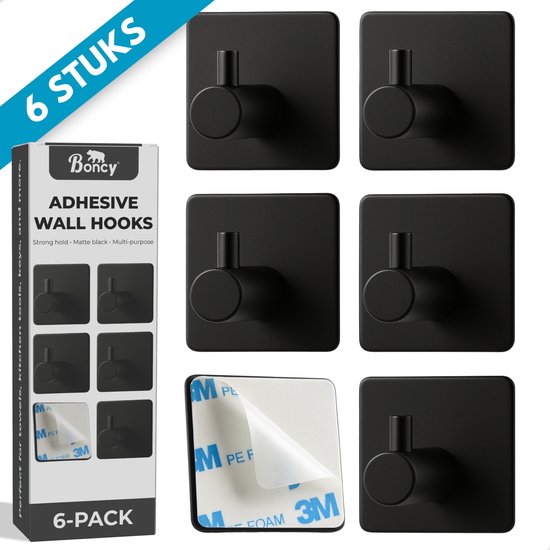 Zes matte zwarte plakhaakjes met een cilindervormige haak, weergegeven op een witte achtergrond. De verpakking toont '6 STUKS' en 'BONY ADHESIVE WALL HOOKS'.