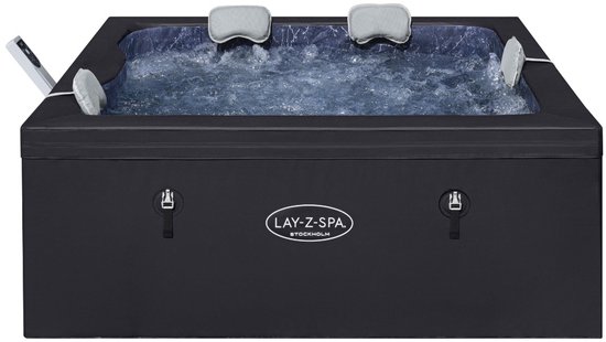 Zwarte Lay-Z Spa Stockholm jacuzzi met bubbels, kussens en een bedieningspaneel.