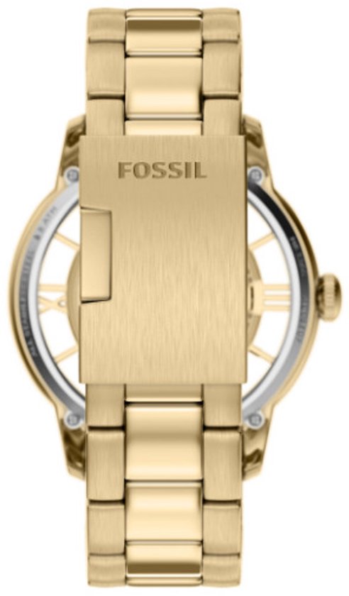 Gesloten gesp van een goudkleurig Fossil horloge met het Fossil logo erop.