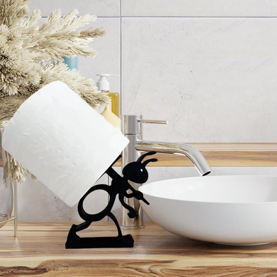 Zwarte metalen toiletrolhouder in de vorm van een mier die een rol papier draagt.