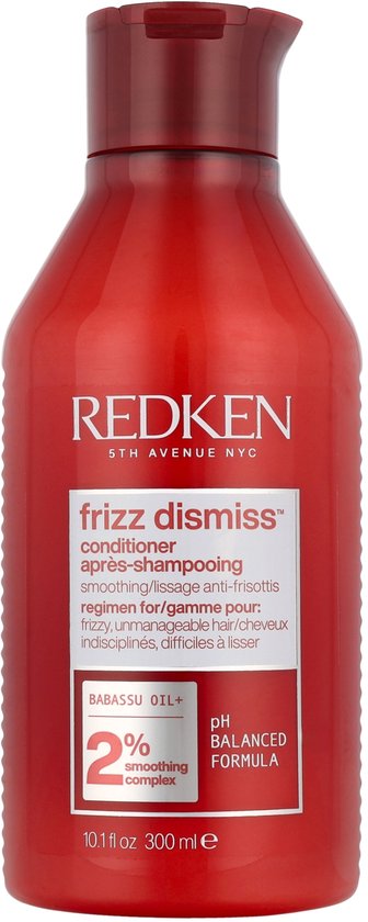 Après-shampooing Redken Frizz Dismiss dans un flacon rouge avec étiquettes blanche et orange. Contient 2% de complexe lissant.