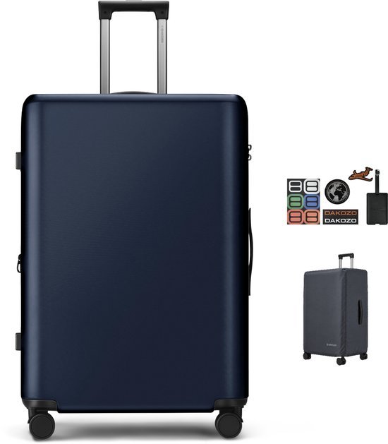 Valise DAKOZO bleu foncé avec poignée trolley, roulettes et accessoires tels que des autocollants et une housse.