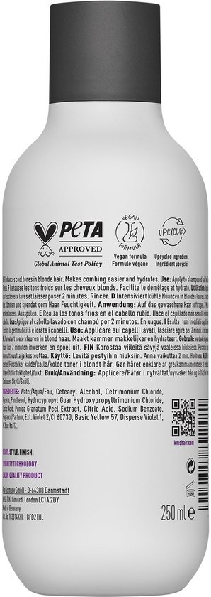 Achterkant van een KMS Color Vitality Blonde Conditioner fles met PETA- en vegan-logo's en ingrediëntenlijst.