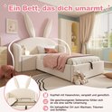 Beige kinderbed met konijnenoren, het bed is opengeklapt om de opbergruimte te tonen.