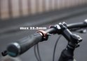 Koperkleurige fietsbel bevestigd aan een fietsstuur, met tekst 'max 22.2mm'.