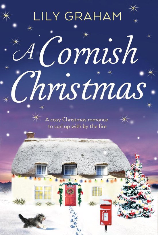 Boekcover met de titel "A Cornish Christmas" van LILY GRAHAM. Een idyllisch huisje met kerstverlichting en een kerstboom voor een winterse zonsondergang.