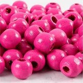 Houten kralen d: 10 mm gatgrootte 3 mm roze 20gr circa 70 stuk