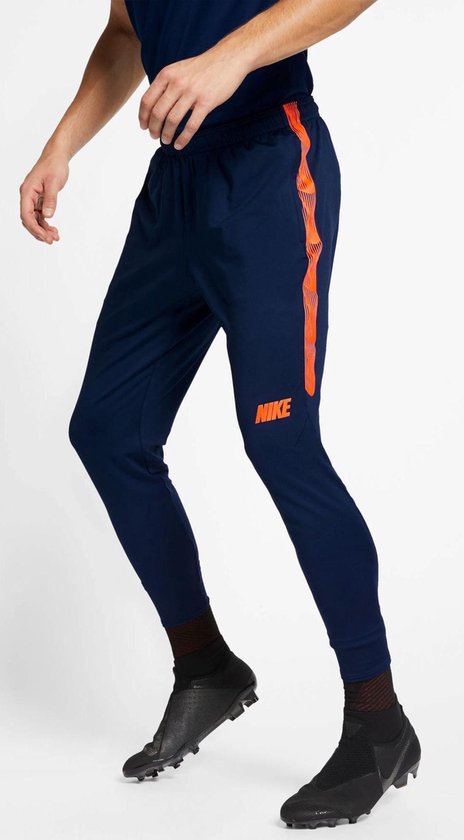 Blozend taart Madison Nike Sportbroek - Maat M - Mannen - navy/oranje | bol.com