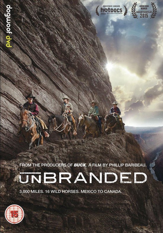 DVD-cover "Unbranded": vier ruiters op paarden langs een steile rotswand, met "3,000 Miles. 16 Wild Horses. Mexico to Canada." onderaan.