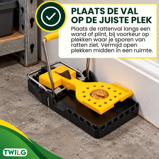 Zwarte en gele rattenval geplaatst langs een plint met pindakaas als lokaas.