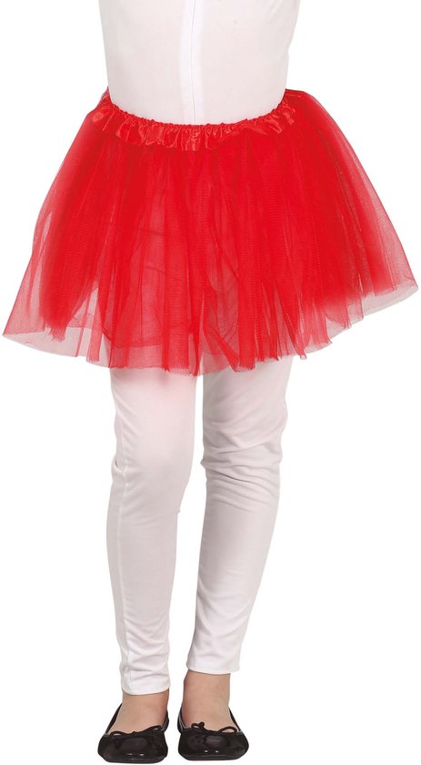 Onderlichaam van een kind met een rode tutu, witte legging en zwarte schoenen.
