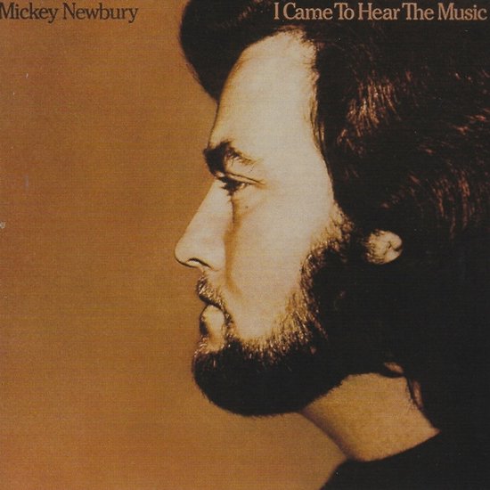 Albumcover van Mickey Newbury met 'I Came To Hear The Music'. Profiel van een man met donker haar en baard, bruine achtergrond.