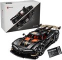 Zwarte Koenigsegg speelgoedauto, deuren open, met doos en informatiekaart.