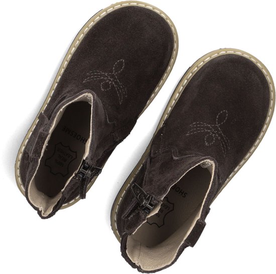 Bruine suède enkellaarsjes met ritssluiting en '100% REAL LEATHER' opdruk.