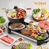 Elektrische grill met hot pot met milde en pittige bouillon, gegrild vlees, garnalen, coquilles en groenten.