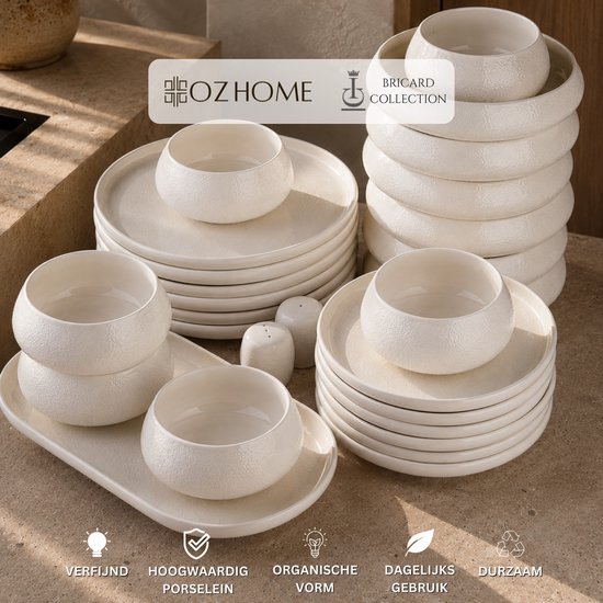 Wit Aragon porseleinen servies met subtiele reliëfdetails, gestapelde borden, kommen, een schaal en peper- & zoutvaatjes. Verfijnd, duurzaam.