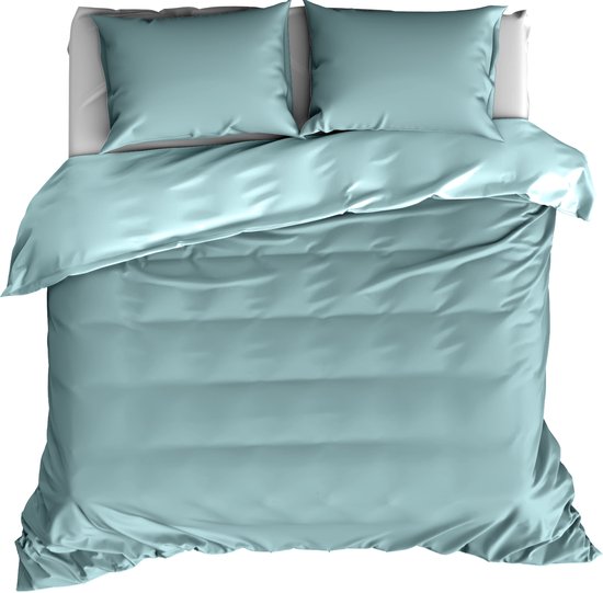 Housse de couette bleu sarcelle avec deux taies d'oreiller, lit fait