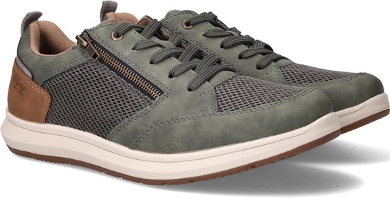 Paar groene sneakers met rits en bruine accenten, vanuit een hoek.