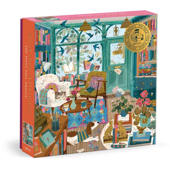 Doos van de 'Bookshop Afternoon' 500-delige puzzel met folie-details. Een gezellige boekenwinkel interieur met boeken, planten en huisdieren.