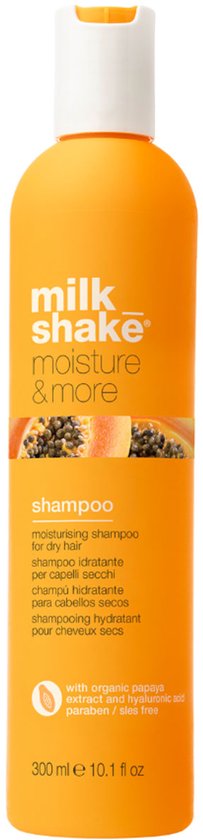 Oranje fles Milk Shake Moisture & More shampoo met papaja-illustratie en de tekst 'shampoo'.