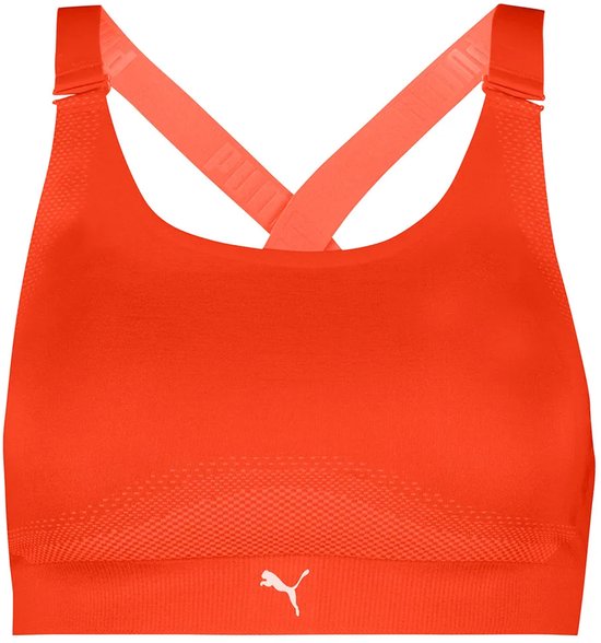 Oranje Puma sportbeha met gekruiste bandjes en Puma-logo.