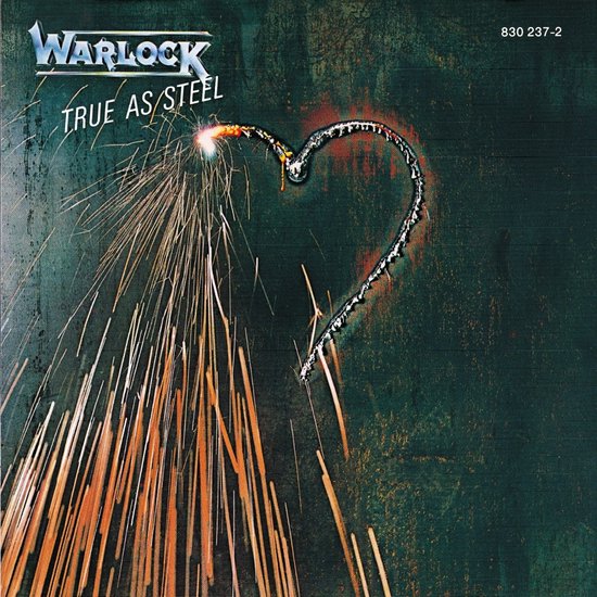 Albumhoes met de titel "Warlock TRUE AS STEEL". Een hart van gloeiend metaal wordt uitgesneden met vonken.