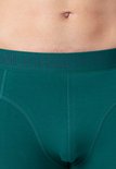 Close-up van een smaragdgroene Muchachomalo boxershort met het ingeweven "MUCHACHOMALO" logo op de tailleband.