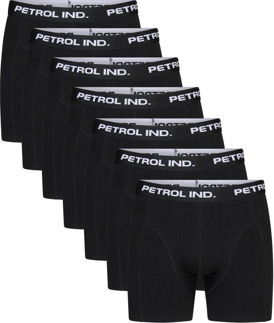 Zeven zwarte boxershorts opgestapeld, elk met witte band met "PETROL IND." opdruk.