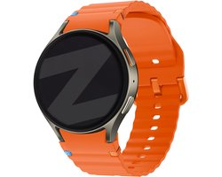 Bandz Siliconen Wave bandje 'Easy fit' - Geschikt voor Samsung Galaxy Watch 7 (40 & 44mm) / Galaxy Watch 6 Classic (43 & 47mm) / Galaxy Watch 5 (Pro) / Galaxy Watch 4 (Classic) / Galaxy Watch FE (oranje)