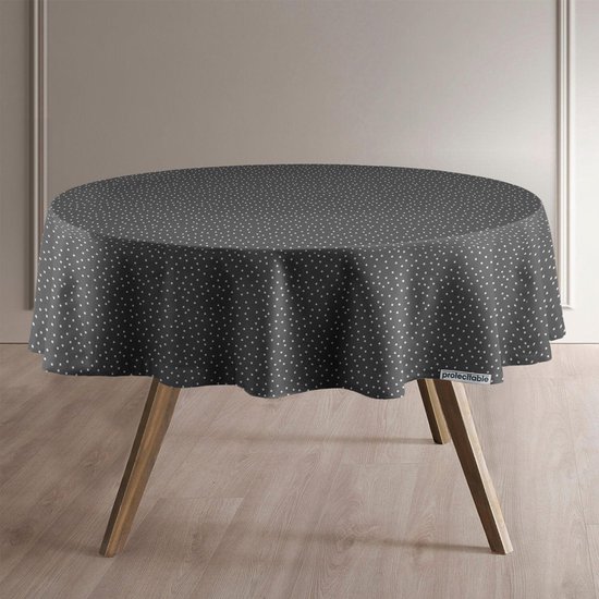 Donkergrijs rond tafelzeil met een witte polkadot print, geplaatst op houten tafelpoten.