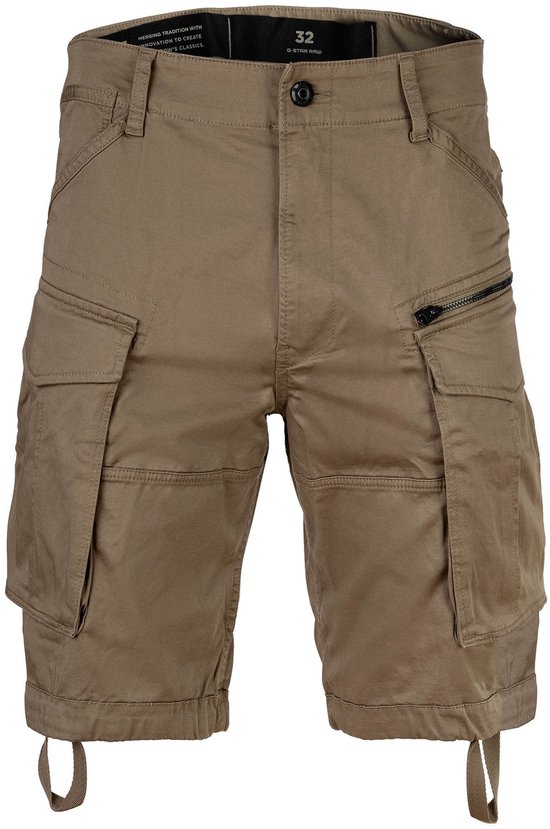Beige cargo short met ritsen, grote zakken, en trekkoorden aan de onderkant. Maat 32.