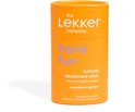 Oranje container met "the Lekker company", "have fun" en "natural deodorant stick mandarin lemon" opdruk.
