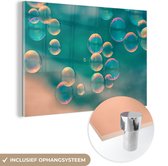 MuchoWow® Glasschilderij 120x80 cm - Schilderij acrylglas - Zeepbelletjes op een turquoise achtergrond - Foto op glas - Schilderijen