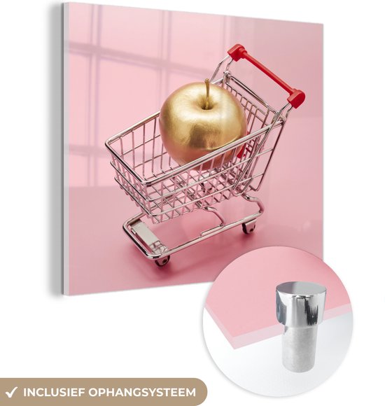 MuchoWow® Glasschilderij 20x20 cm - Schilderij acrylglas - Stilleven een miniatuur winkelwagen met een gouden appel erin - Foto op glas - Schilderijen