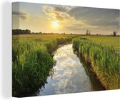 Canvas Schilderij Kreek bij zonsondergang - 180x120 cm - Wanddecoratie XXL