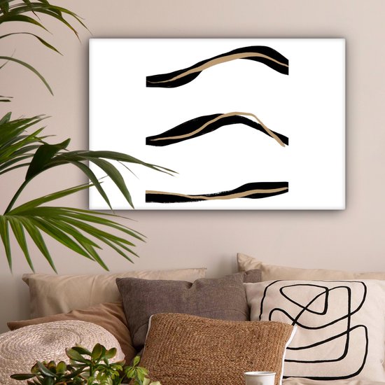 Canvas met drie abstracte, golvende lijnen in het zwart en goud op een witte achtergrond.