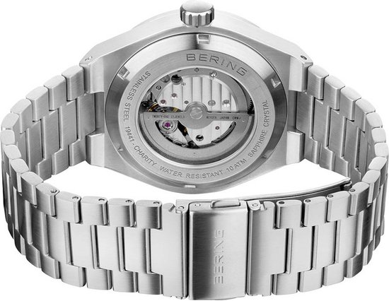 Zilverkleurig horloge met zichtbaar automatisch uurwerk op de achterkant. BERING, STAINLESS STEEL.