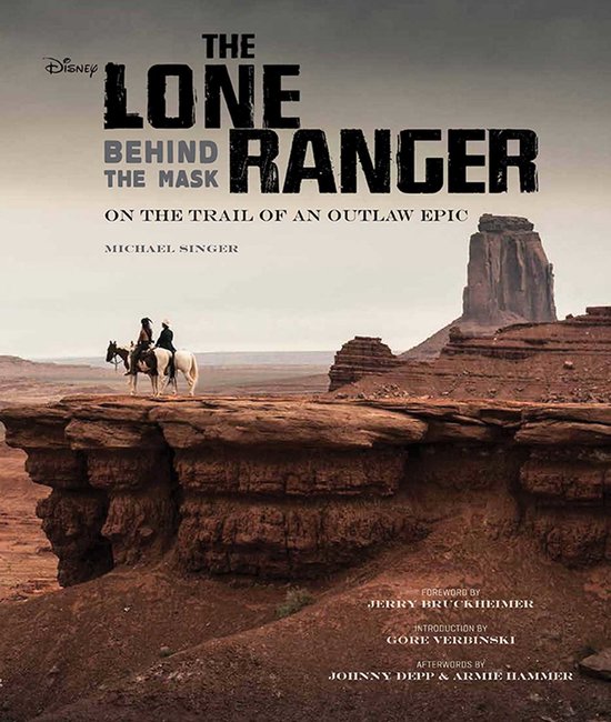 Boekhoes "The Lone Ranger Behind the Mask" met twee ruiters op een witte paard, in woestijnlandschap.